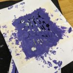 stencil with purple paint