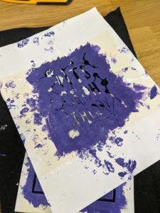 stencil with purple paint