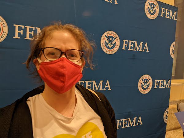 Pam in front of FEMA backdrop